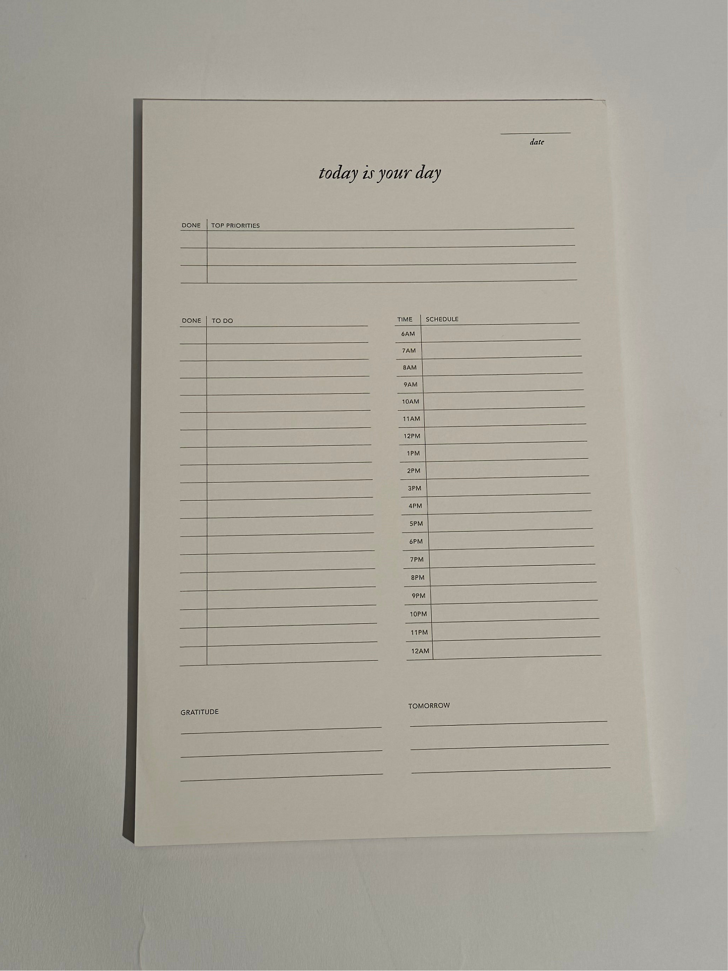 A Today is Your Day Daily Notepad with 50 pages of cream paper, designed for goal-setting, task management, and inspiration, featuring an elegant design.