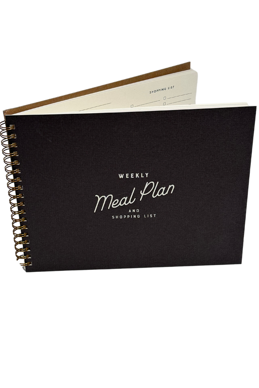 A retro-inspired weekly meal planner with a peppercorn cover and white ink, featuring space for 3 meals a day, snacks, and a tear-off shopping list.