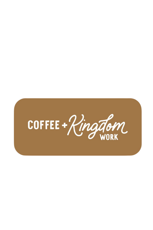 Coffee + Kingdom Work™ vinyl sticker in black lettering on a white background; 3 x 1.5 inch durable, weatherproof decal shown on a journal.